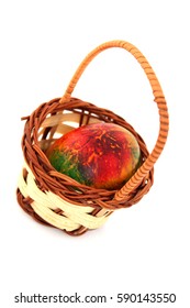 Colored easter egg in basket
