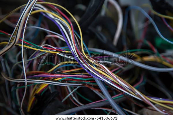 colored\
electrical cables and wires in a old\
car