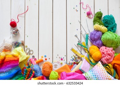 Colored fabric, yarn, thread, crayons and paints. Colored materials for creative work on the table. Do needlework. Everything for handmade. - Powered by Shutterstock