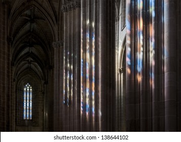 Colored flecks from windows on the columns of the Batalha Santa Maria da Vitoria Dominican abbey, Portugal - Powered by Shutterstock