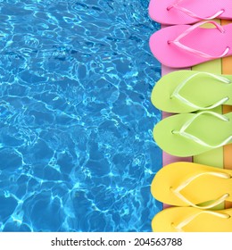 Colored Flip Flops On Wooden Platform Beside Sea