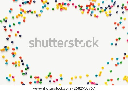 Colored frame. Bright frame of beads. Bright beads on a white background. Multicolored wooden beads. Colored background.