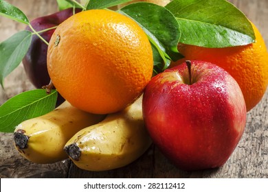 Colored fruits: apple, banana, orange, pear, selective focus