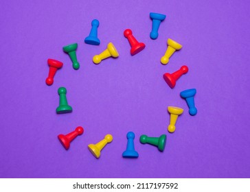 Colored game chips and playing cubes laid out on a purple background in frame: entertainment, games at home for the whole family, the concept of board games. Board game. Table games - Shutterstock ID 2117197592
