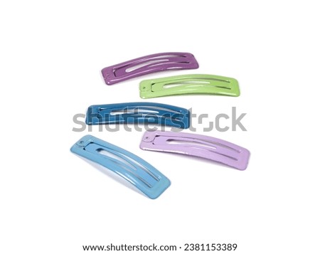 Colored hair clips isolated on white background.