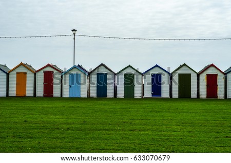 Colored houses on the beach, colorful door to summer cottages, seaside spot, vacation