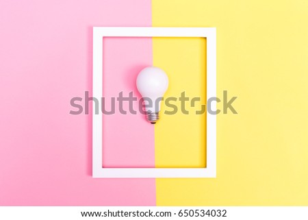 Colored lightbulb on a vibrant duotone background