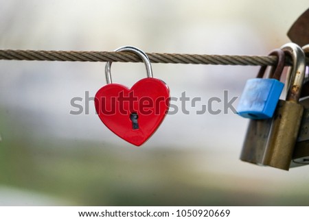 Colored locks hanging on the bridge for love