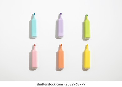 Colored markers pens on a white background. Top view, flat lay. - Powered by Shutterstock