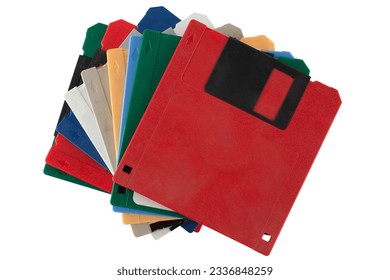 Colored old retro floppy diskettes in stack. Isolated on white background.