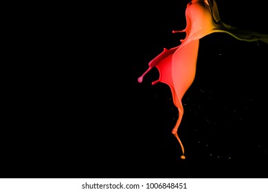 Colored paint splashes isolated on black background
