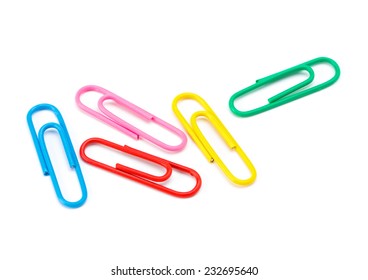 Colored paper clips on a white background closeup