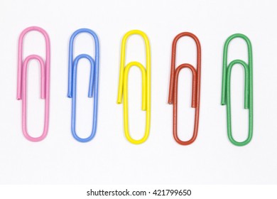 Colored Paper Clips On A White Background