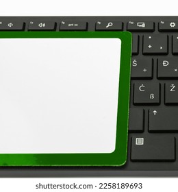 Colored paper with important message lying desk near keyboard. Main information written on notebook. School supplies. Multiple Assorted Collection Office Stationery.