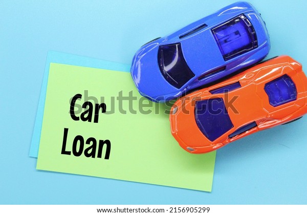 colored\
paper, toy cars with the word car loan\
Concept