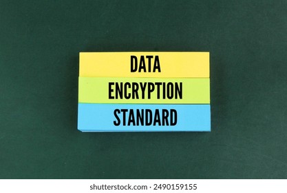 colored paper with the word data encryption standard. the concept of confidential data