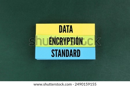 colored paper with the word data encryption standard. the concept of confidential data