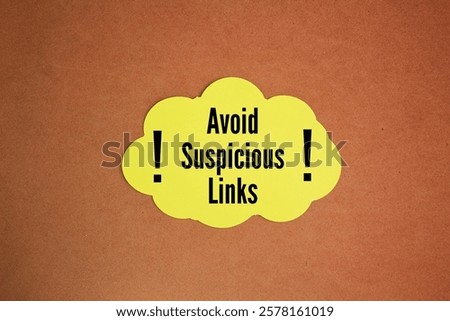 colored paper with the words Avoid suspicious links. relates back to the dangers of a potential cyber-attack, specifically a phishing