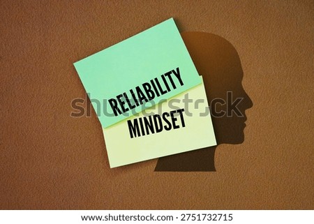 Colored paper with the words reliability mindset. A proactive, cultural and operational approach that prioritizes long-term system stability, security and performance over immediate short-term gains.