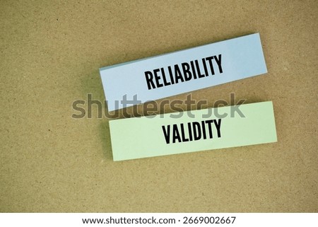 Colored paper with the words reliability and validity. Reliability refers to the consistency of a measure, while validity refers to the accuracy of a measure.