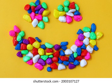 Colored Pebbles On Yellow Background
