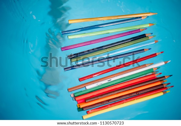 Colored Pencil Floating Blue Water Pool Stock Photo Edit Now 1130570723