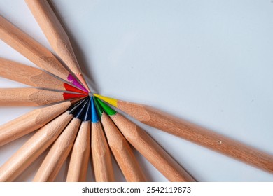 Colored pencils arranged in a half circular pattern. A vibrant, symmetrical design perfect for creative, artistic, and educational concepts. - Powered by Shutterstock