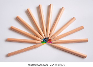 Colored pencils arranged in a tight circular pattern, tips meeting in the center. A vibrant, symmetrical design perfect for creative, artistic, and educational concepts. - Powered by Shutterstock