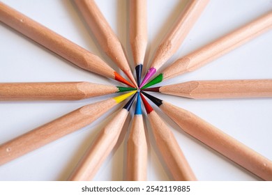 Colored pencils arranged in a tight circular pattern, tips meeting in the center. A vibrant, symmetrical design perfect for creative, artistic, and educational concepts. - Powered by Shutterstock