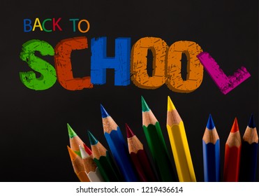 Colored pencils  back to school text written in colorful 3 D Letters  words