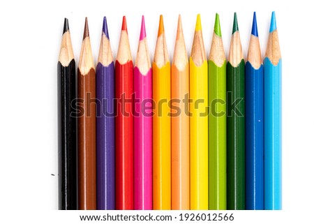 Colored pencils background. Color pencils on white background.