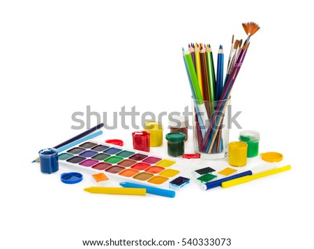 Colored pencils, felt tip pens, chalks, brushes and paint for painting isolated on white background. Tools of artist.