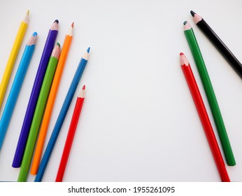 Colored pencils isolated on table, on paper, on white background. Flat lay, top view. - Powered by Shutterstock