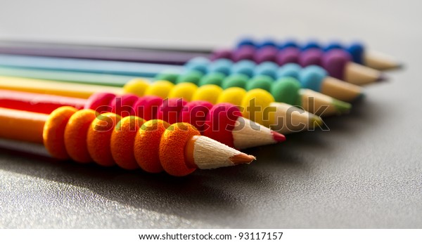 colored pencils on a black desk