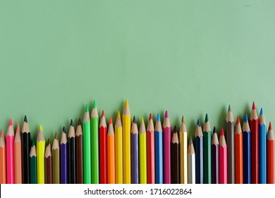 
Colored pencils on a green background - Powered by Shutterstock