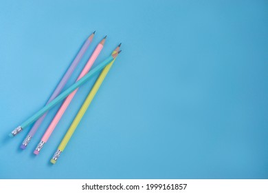 Colored pencils  on a pastel blue background  with copy space for text . Back to school   banner concept - Shutterstock ID 1999161857