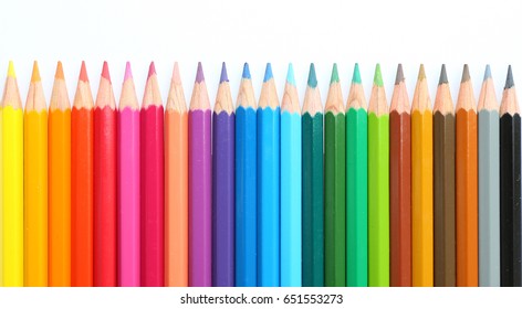 colored pencils row with wave on white background - Shutterstock ID 651553273