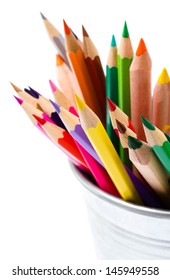 Colored Pencils In Tin Can Or Pencil  Holders And Green Apple, Back To School Supplies Closeup Top View