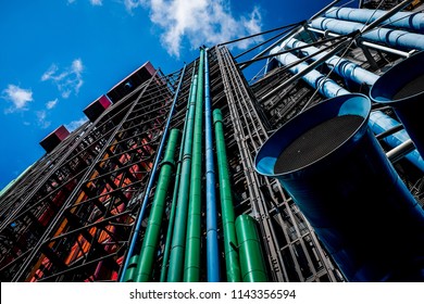Colored pipes on Centre Goerge Pompidou in Paris under blue sky with small clouds
