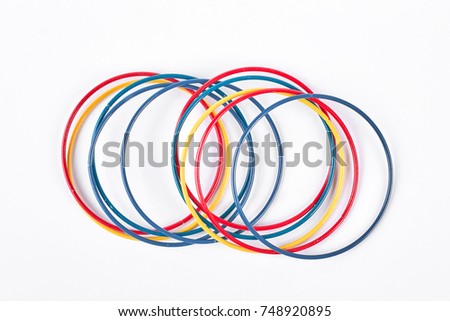 Colored plastic bracelets on white background. Collection of hand bangles of different colors on white background. Stock photo © 