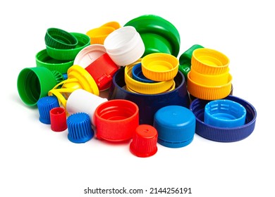 Colored plastic caps from bottles of water isolated on a white background. Close-up, top view. Recycling used plastic - a solution to the problem of plastic contamination. - Powered by Shutterstock