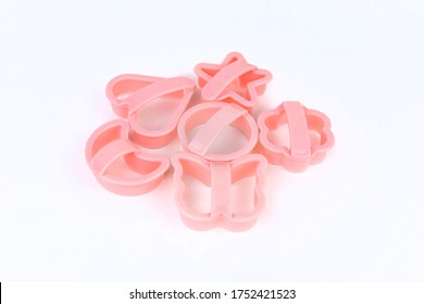 Colored Plastic Cookie Cutters Isolated On White