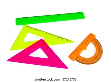 Colored plastic drafting tools - triangles,ruler, protractor isolated on white