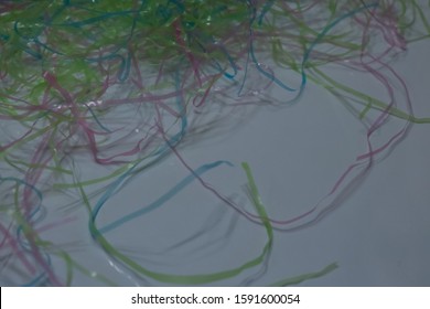 Colored Plastic Easter Grass On A White Background