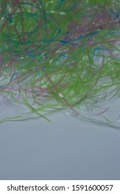 Colored Plastic Easter Grass On A White Background