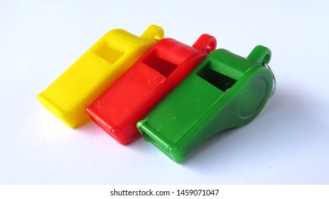 colored plastic whistles are cheap, usually used by parking attendants, scouts, schoolchildren              - Powered by Shutterstock