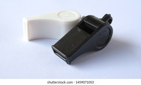 colored plastic whistles are cheap, usually used by parking attendants, scouts, schoolchildren                       - Powered by Shutterstock