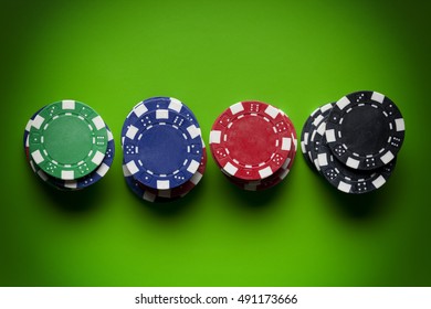 Colored Poker Chips On Green Table