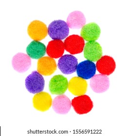 Colored pom pom, party and sewing decoration. Isolated on white background.