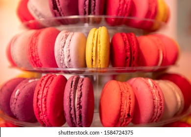 Colored Red Macaroon France Pastry Desserts On Store Counter.